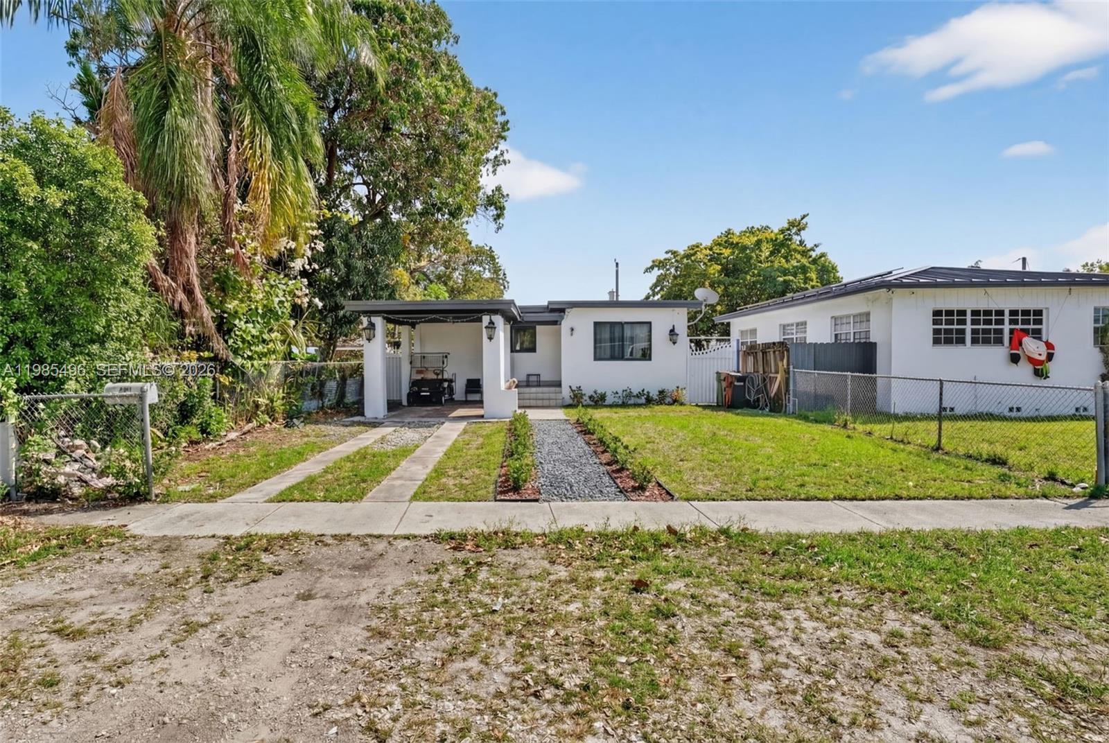 440 East 37th Street Hialeah, FL 33013 - Photo 3 of 27 a view of house with outdoor space and swimming pool