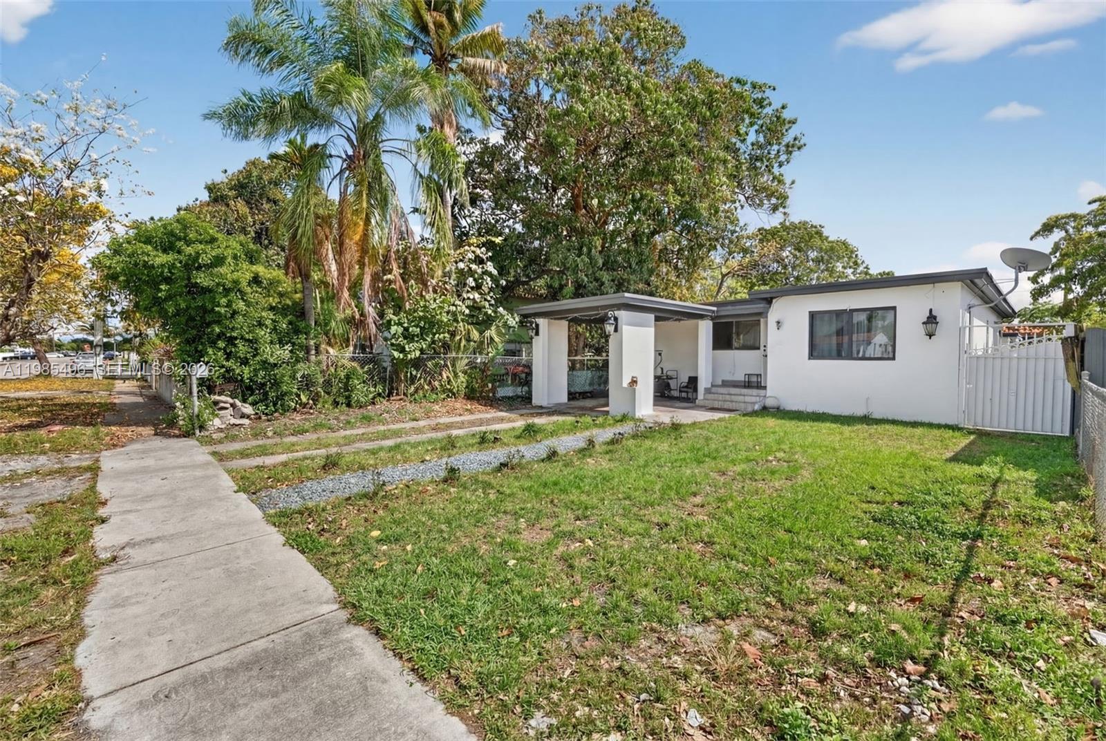 440 East 37th Street Hialeah, FL 33013 - Photo 4 of 27 a front view of house with yard and green space