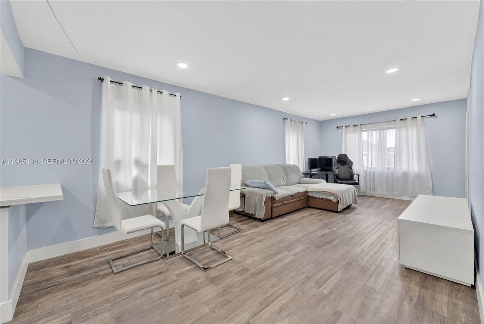 440 East 37th Street Hialeah, FL 33013 - Photo 6 of 27 a living room with furniture and a table