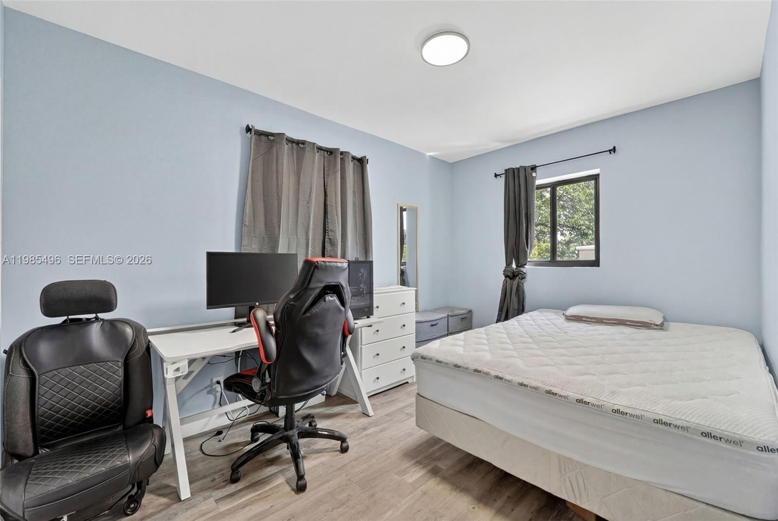 440 East 37th Street Hialeah, FL 33013 - Photo 9 of 27 a bedroom with a workspace
