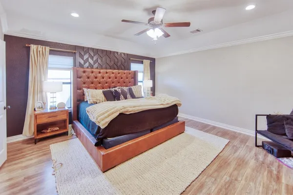 a bedroom with a bed and window