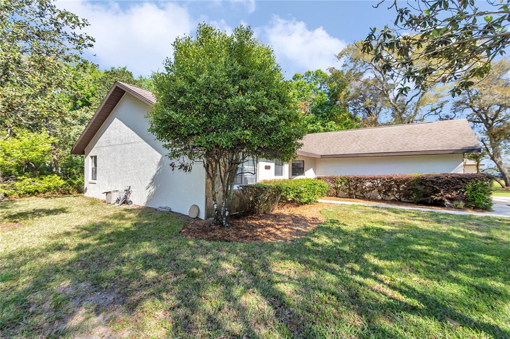 8160 Southwest 53rd Court Ocala, FL 34476 - Photo 11 of 54 a front view of house with yard and trees in the background