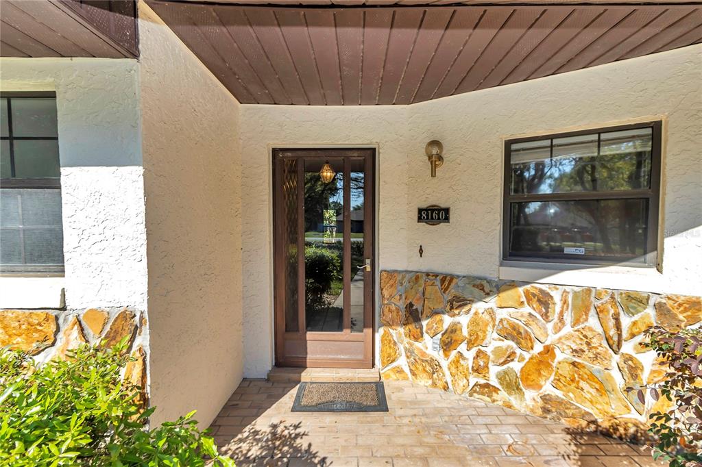 8160 Southwest 53rd Court Ocala, FL 34476 - Photo 15 of 54 a front view of a house with a glass door
