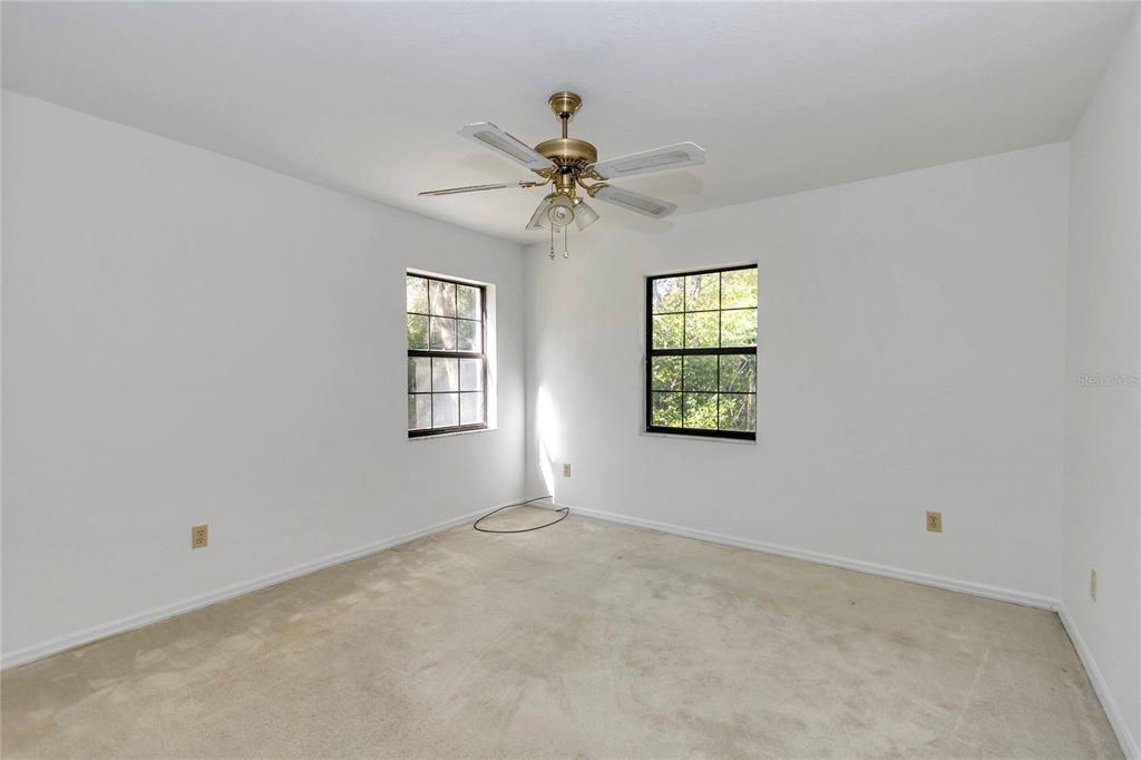 8160 Southwest 53rd Court Ocala, FL 34476 - Photo 23 of 54 an empty room with windows and fan