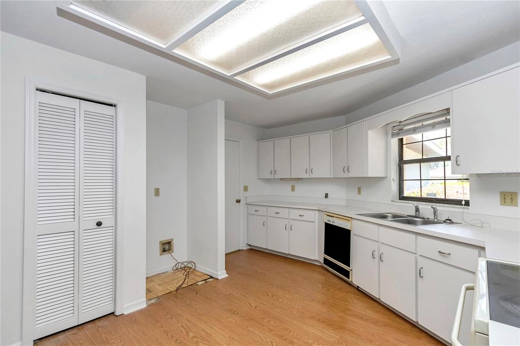 8160 Southwest 53rd Court Ocala, FL 34476 - Photo 27 of 54 a kitchen with a sink stove and cabinets