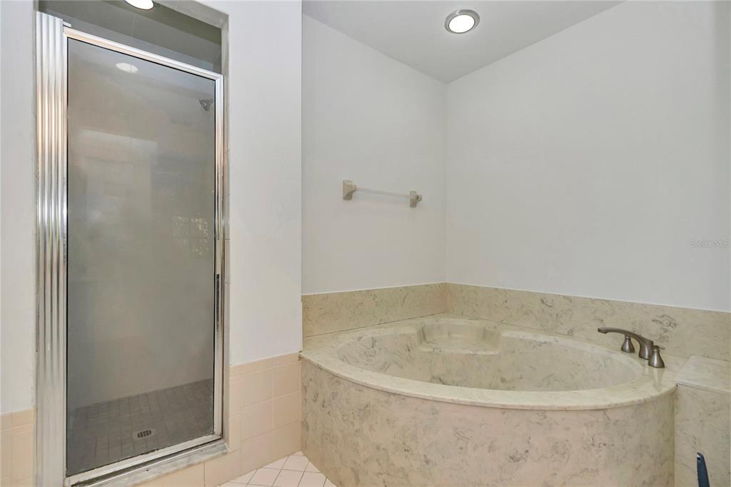 8160 Southwest 53rd Court Ocala, FL 34476 - Photo 37 of 54 a bathroom with a tub and shower