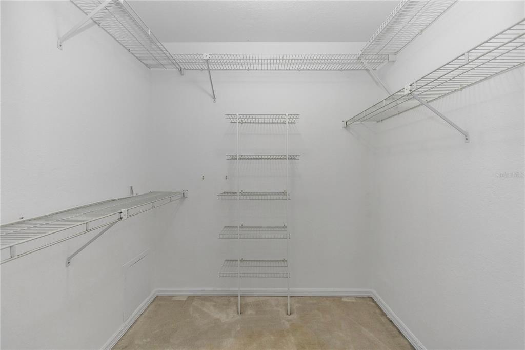 8160 Southwest 53rd Court Ocala, FL 34476 - Photo 40 of 54 a view of walk in closet with empty racks