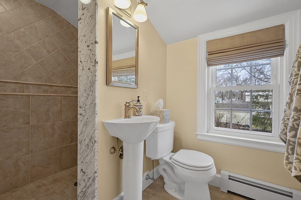 8 Leland Road Natick, MA 01760 - Photo 12 of 21 a bathroom with a sink toilet and shower