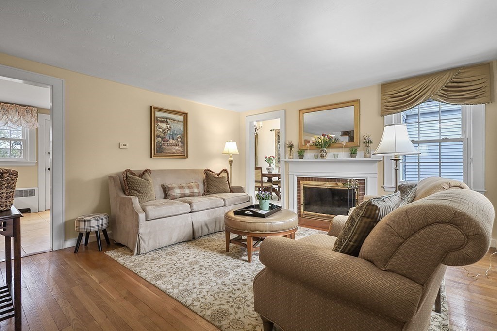 8 Leland Road Natick, MA 01760 - Photo 7 of 21 a living room with furniture a fireplace and a window