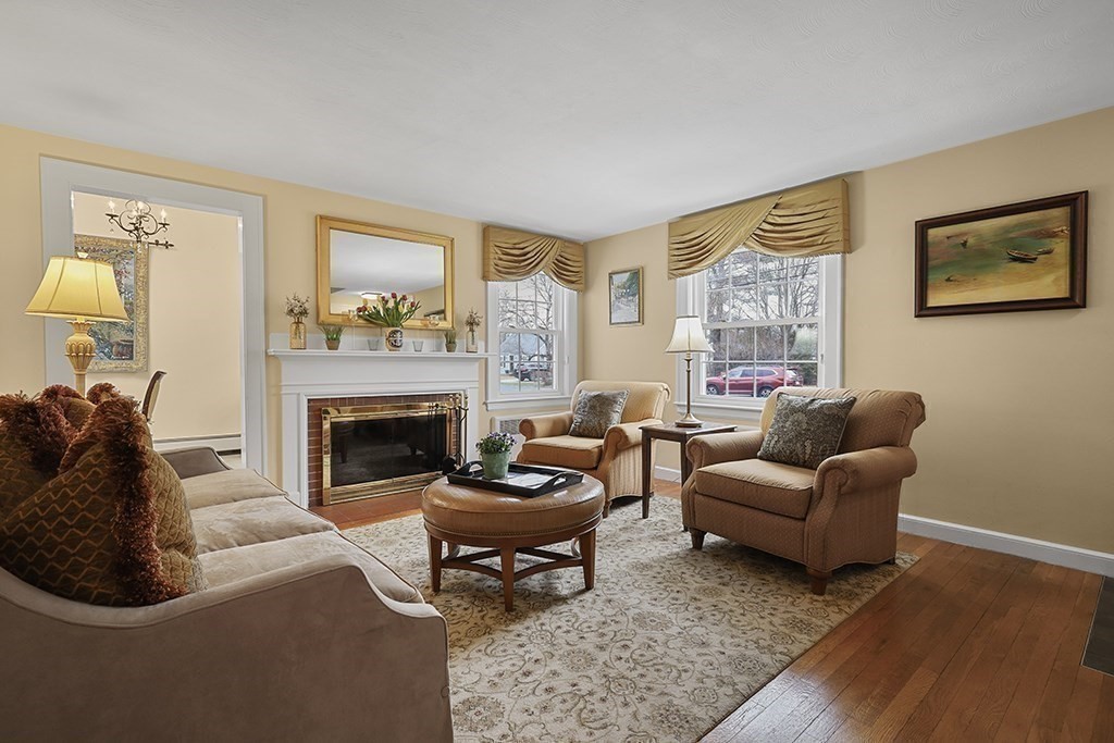 8 Leland Road Natick, MA 01760 - Photo 8 of 21 a living room with furniture and a fireplace