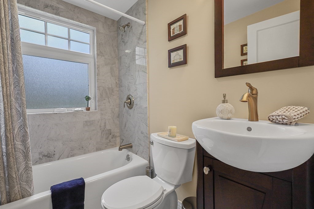 8 Leland Road Natick, MA 01760 - Photo 9 of 21 a bathroom with a sink toilet and shower