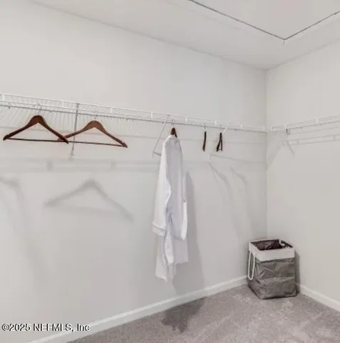 a view of a balcony with chairs and wooden floor