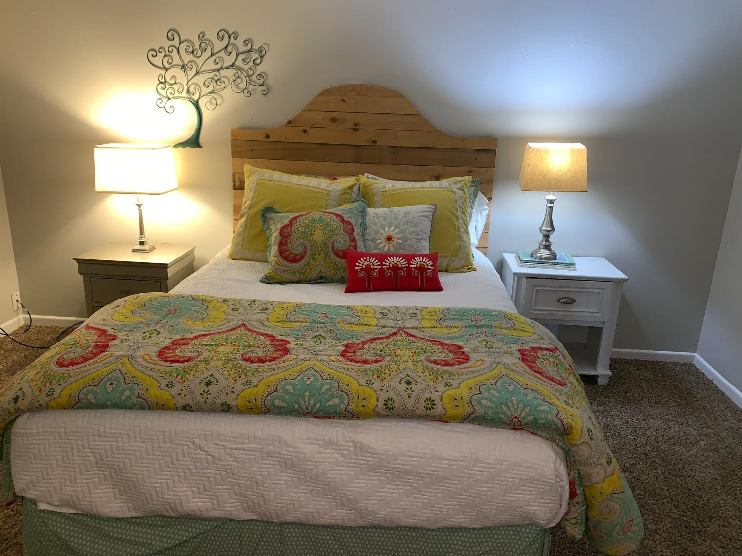 5009 16th Street Lubbock, TX 79416 - Photo 11 of 16 a bedroom with a bed and a lamp