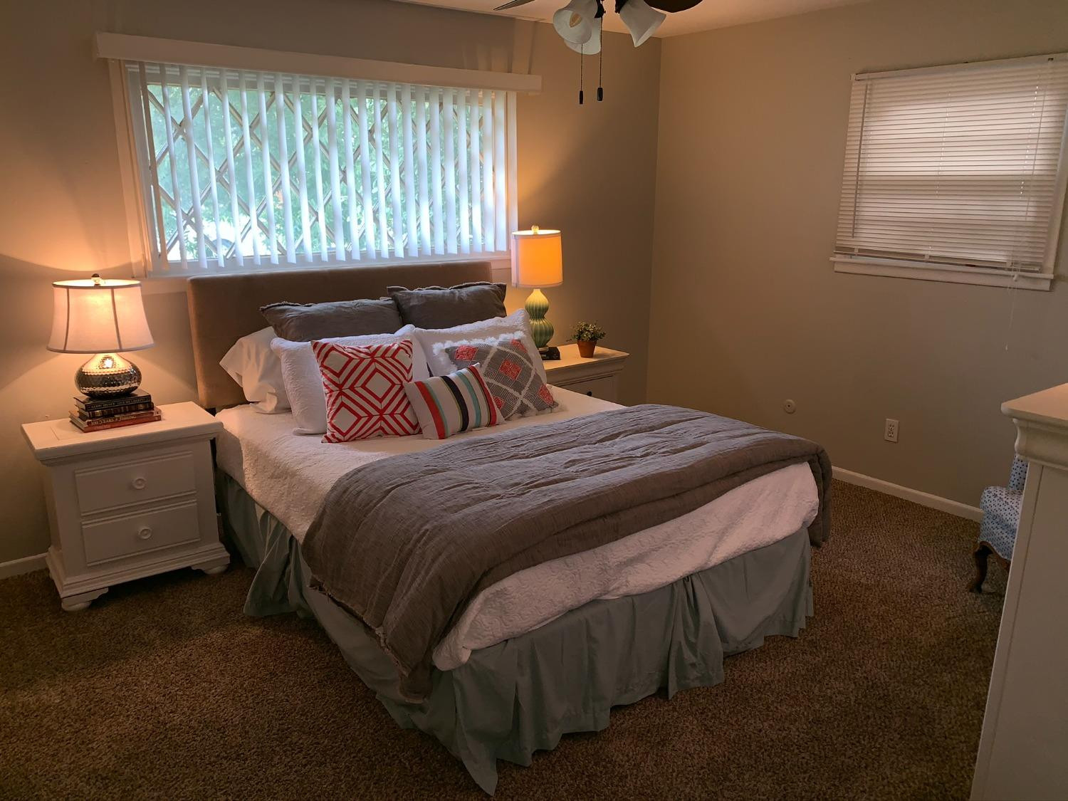 5009 16th Street Lubbock, TX 79416 - Photo 12 of 16 a bedroom with a bed and a window