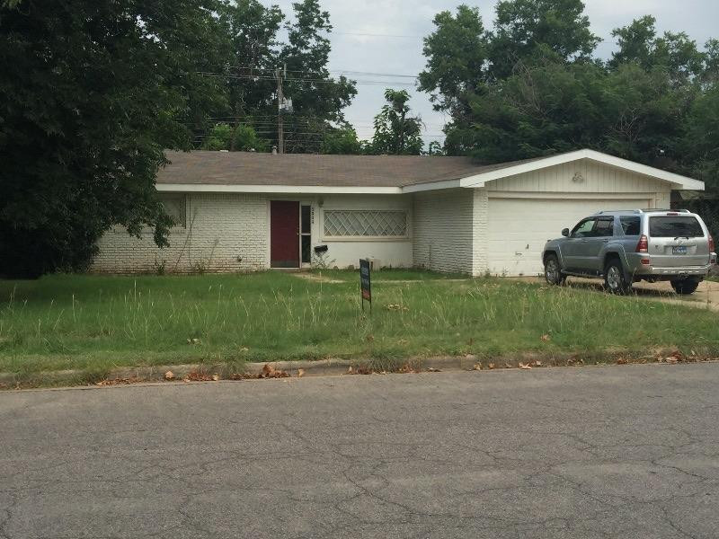 5009 16th Street Lubbock, TX 79416 - Photo 16 of 16 a front view of a house with a yard and garage