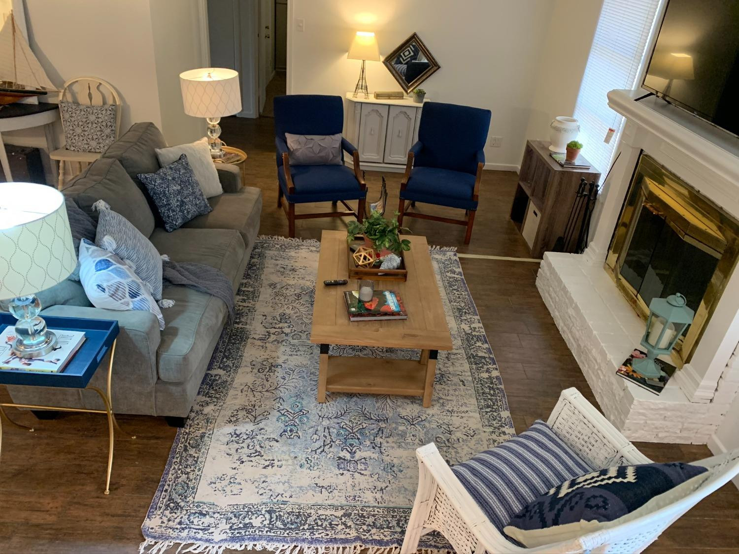 5009 16th Street Lubbock, TX 79416 - Photo 5 of 16 a living room with furniture and a fireplace