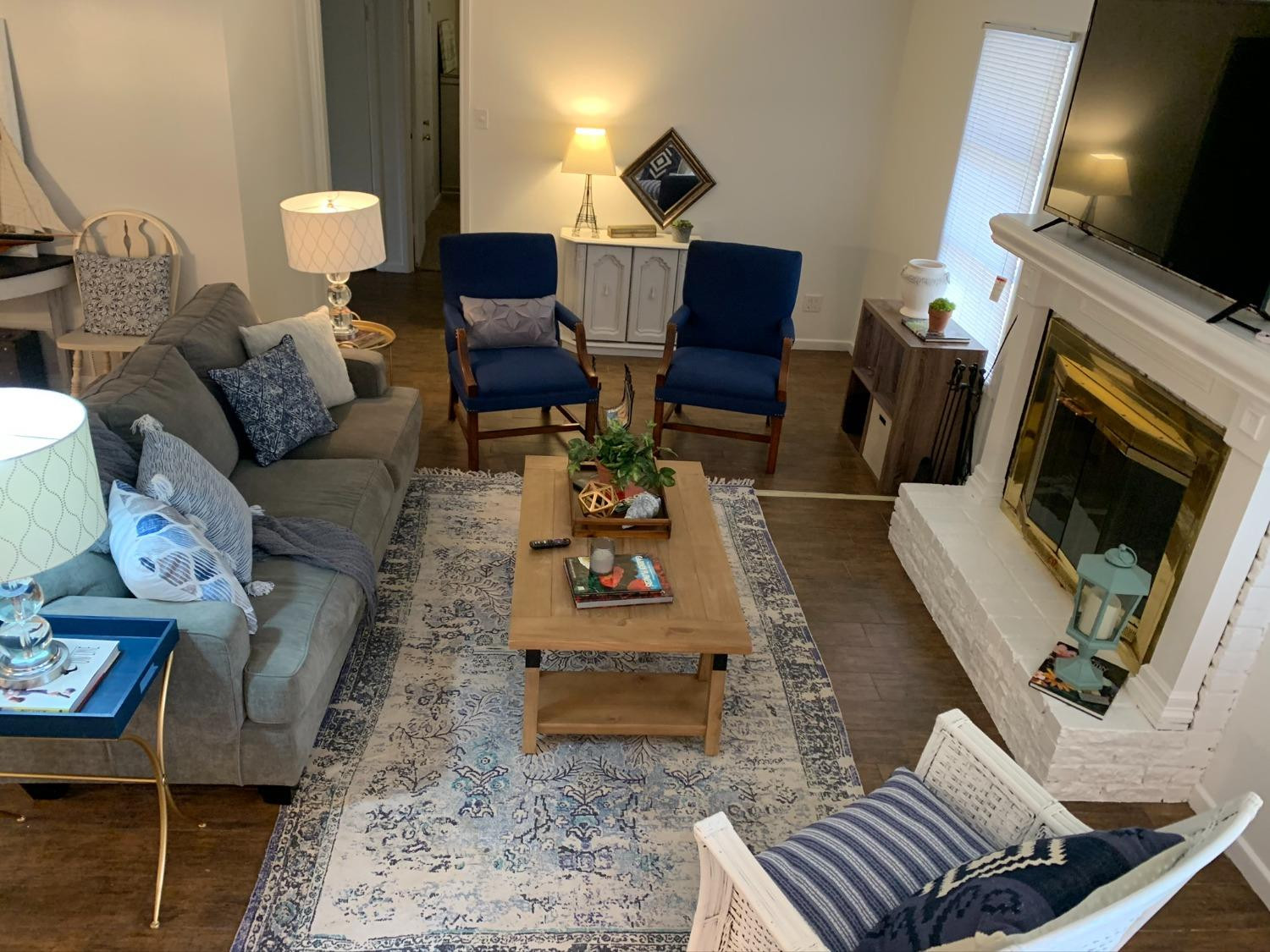 5009 16th Street Lubbock, TX 79416 - Photo 6 of 16 a living room with furniture and a fireplace