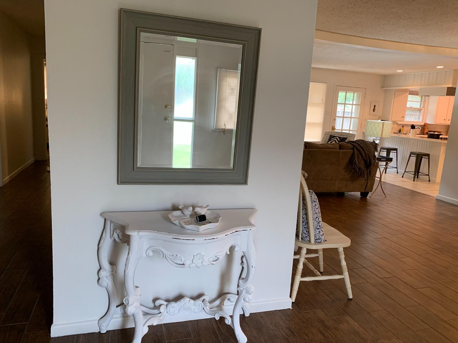 5009 16th Street Lubbock, TX 79416 - Photo 8 of 16 a dining room with furniture and wooden floor