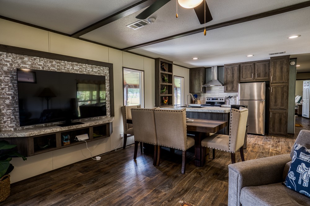 35418 Tompkins Road Hempstead, TX 77445 - Photo 15 of 50 a dining room with furniture a chandelier and wooden floor
