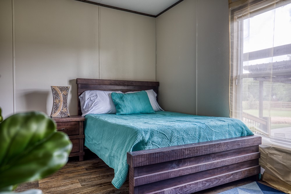 35418 Tompkins Road Hempstead, TX 77445 - Photo 18 of 50 a bedroom with a bed and a window