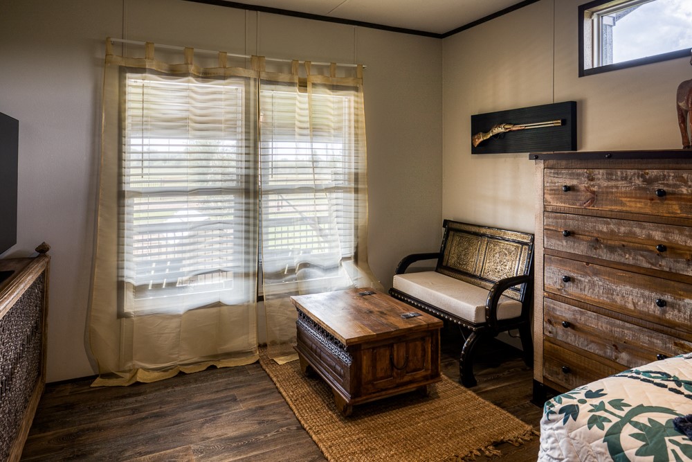 35418 Tompkins Road Hempstead, TX 77445 - Photo 23 of 50 a living room with furniture and a flat screen tv