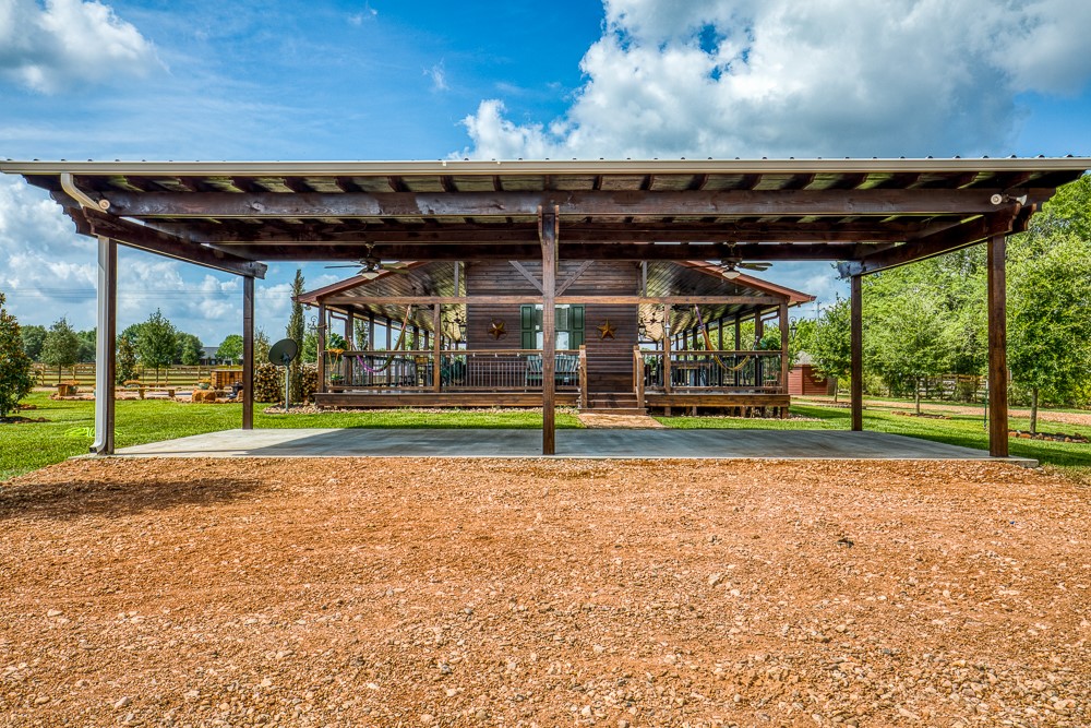 35418 Tompkins Road Hempstead, TX 77445 - Photo 28 of 50 a view of a swimming pool with a yard