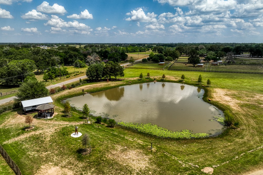 35418 Tompkins Road Hempstead, TX 77445 - Photo 40 of 50 a view of a swimming pool with a yard