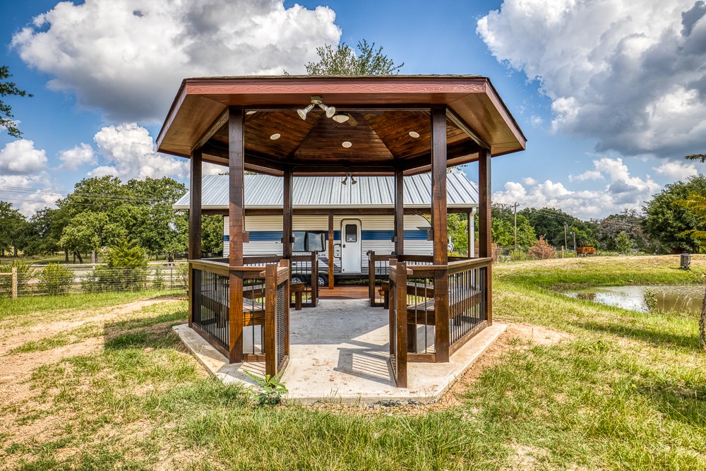 35418 Tompkins Road Hempstead, TX 77445 - Photo 43 of 50 a view of a swimming pool with a patio and a yard