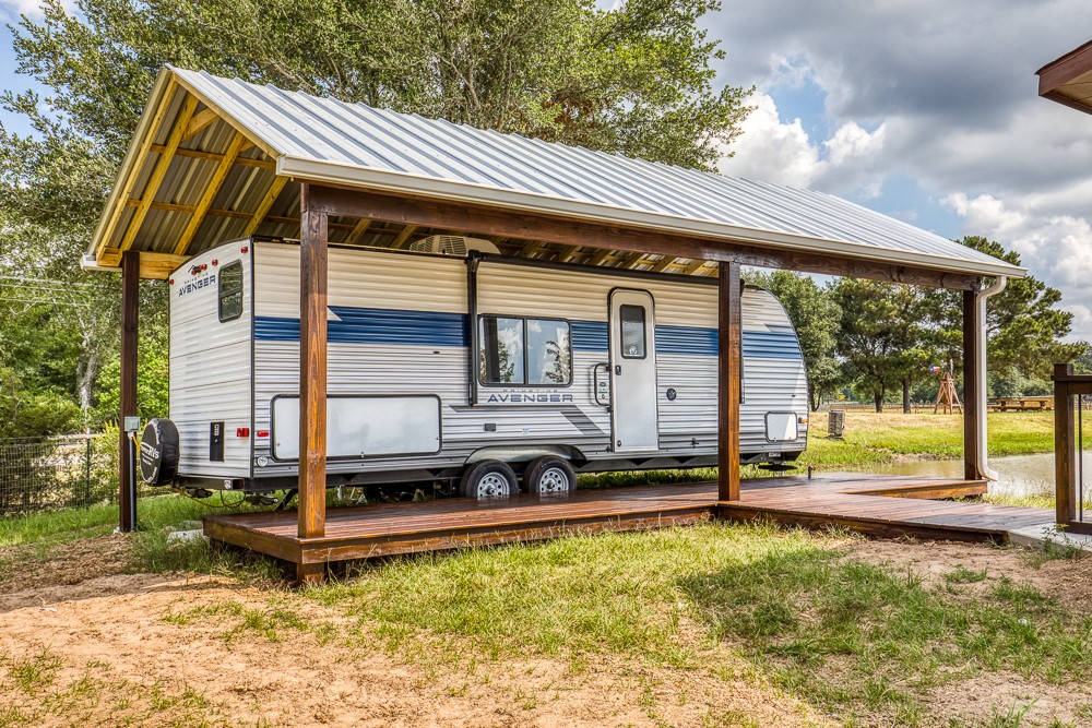 35418 Tompkins Road Hempstead, TX 77445 - Photo 44 of 50 a view of a house with a backyard and a patio