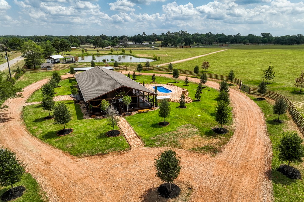 35418 Tompkins Road Hempstead, TX 77445 - Photo 45 of 50 a view of a lake with a house