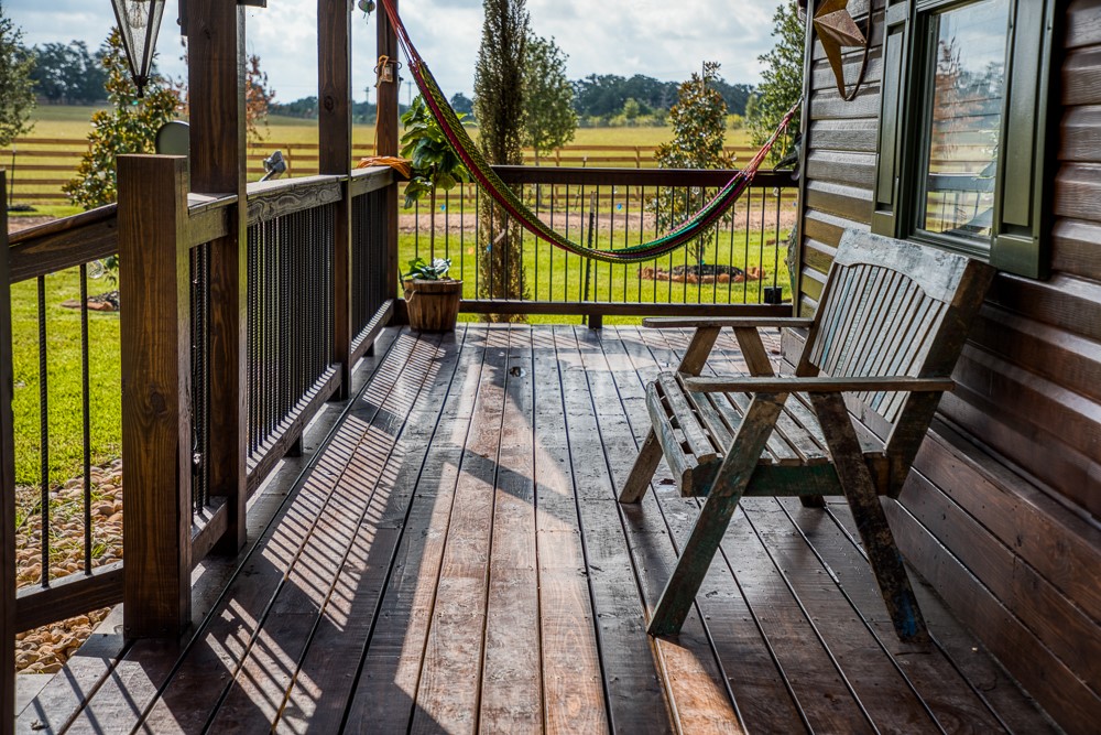 35418 Tompkins Road Hempstead, TX 77445 - Photo 8 of 50 a view of balcony with wooden floor and outdoor seating