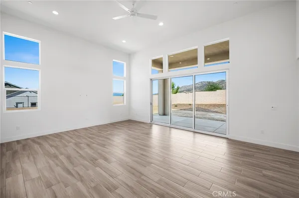 a view of kitchen with furniture and wooden floor