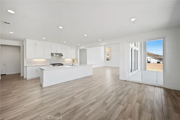 a kitchen with a sink and a window