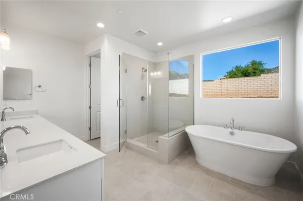 a bathroom with a bathtub and a toilet