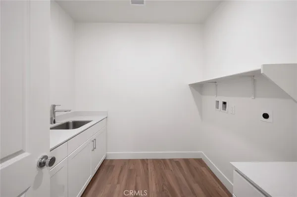 a bathroom with a sink toilet vanity and mirror
