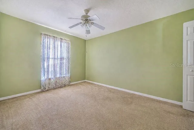 a utility room with wooden floor washer and dryer