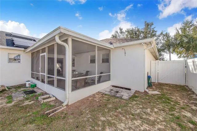 a view of a house with a yard and garage