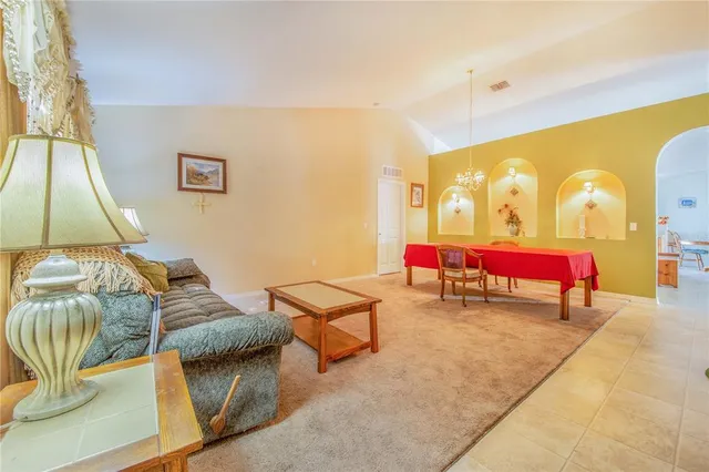 a bedroom with a bed and a table