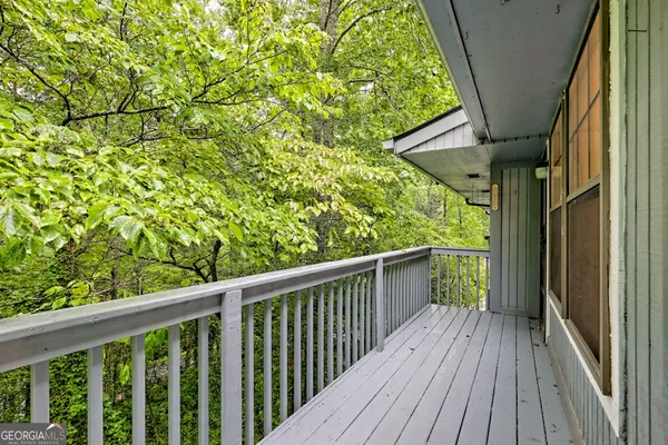 a view of balcony with wooden floor