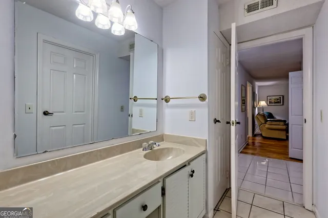 a bathroom with a sink a vanity and a mirror