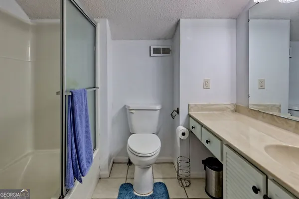 a en suite bathroom with a sink double vanity and a mirror
