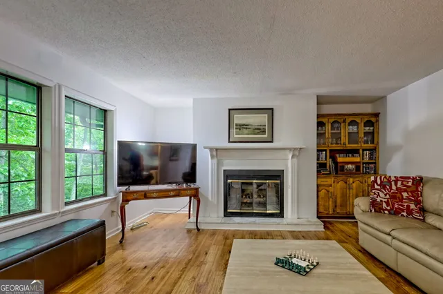 a living room with furniture and a fireplace