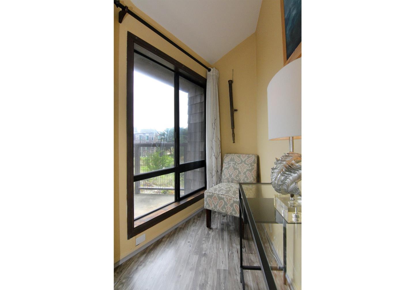 66 Pelican Point Watsonville, CA 95076 - Photo 15 of 30 a living room with furniture and a large window