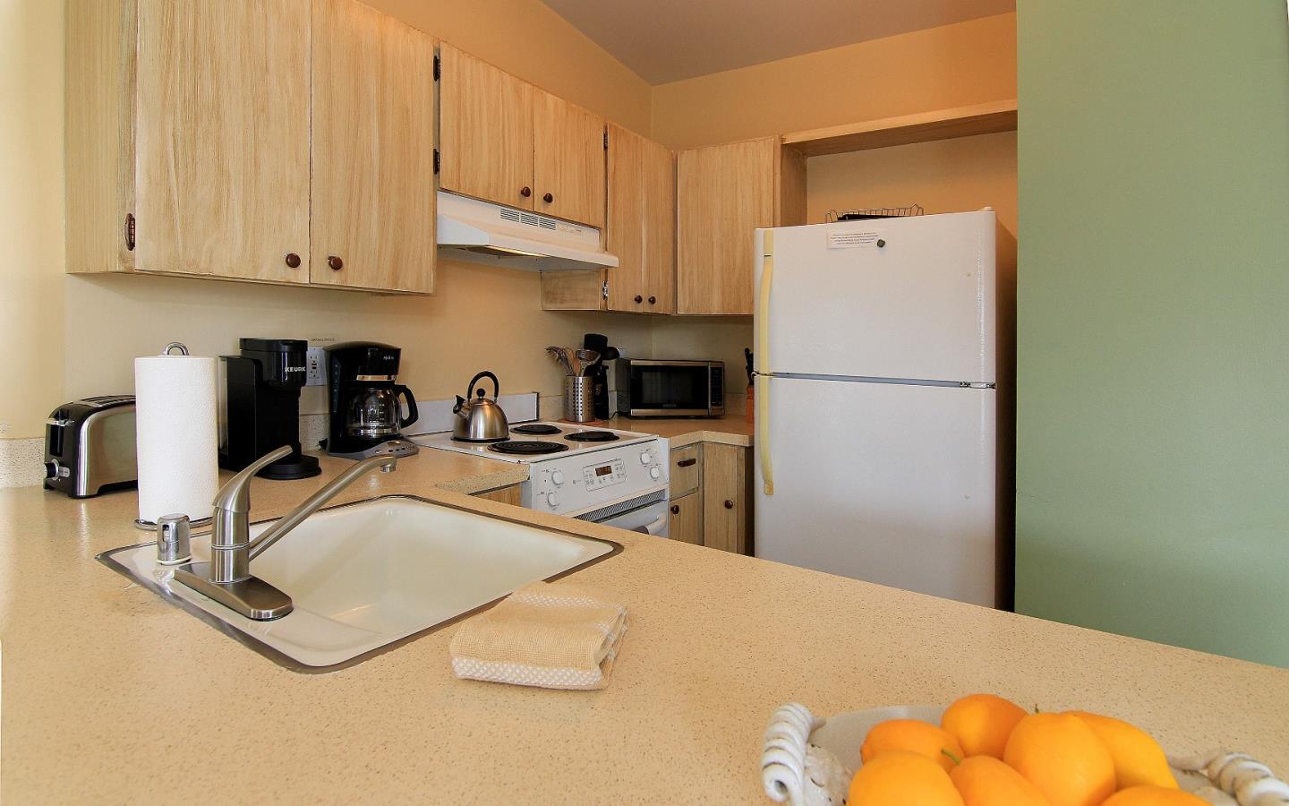 66 Pelican Point Watsonville, CA 95076 - Photo 17 of 30 a kitchen with a sink a stove and a refrigerator