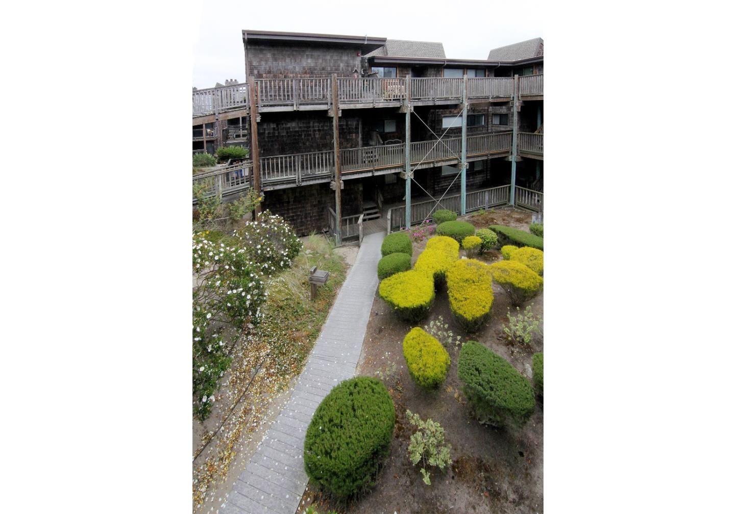 66 Pelican Point Watsonville, CA 95076 - Photo 23 of 30 a view of a backyard with table and chairs
