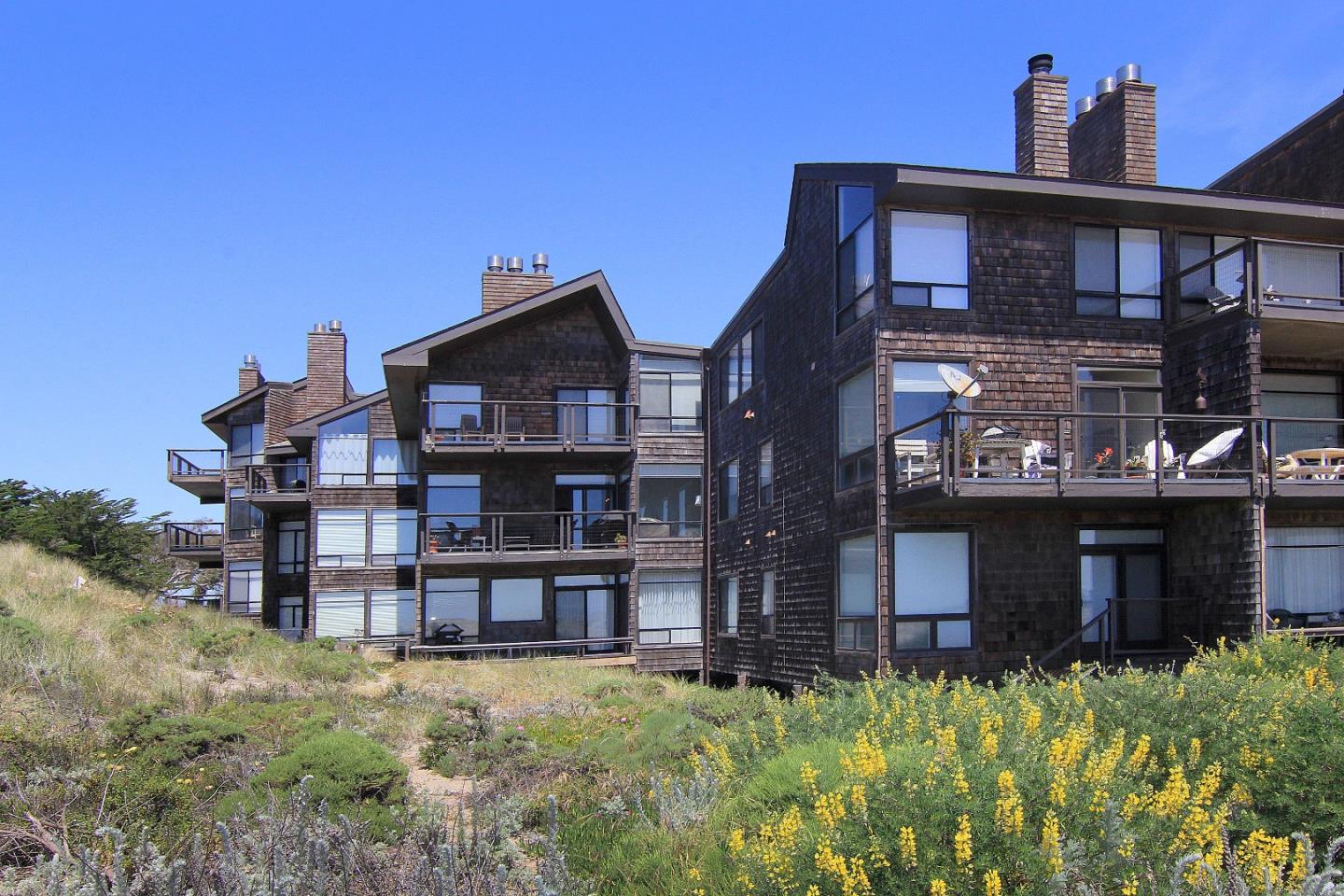 66 Pelican Point Watsonville, CA 95076 - Photo 4 of 30 a view of a big house with many windows