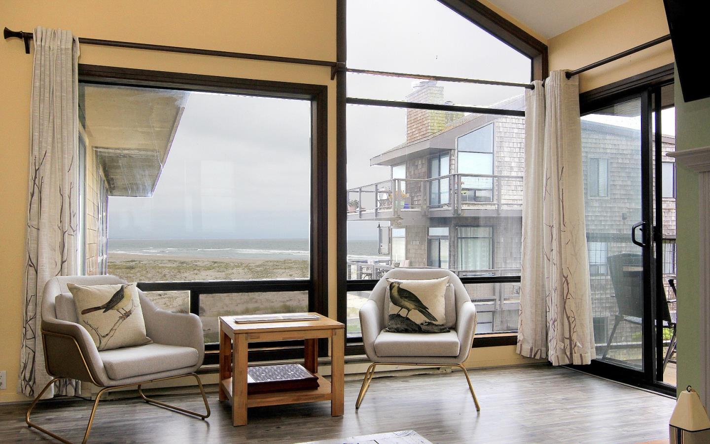 66 Pelican Point Watsonville, CA 95076 - Photo 10 of 30 a living room with furniture and a floor to ceiling window