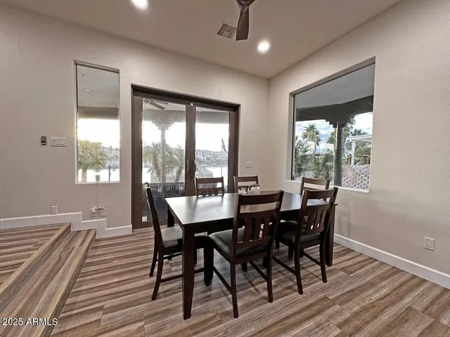 a view of a dining room with furniture window and outside view
