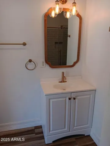 a bathroom with a sink and mirror