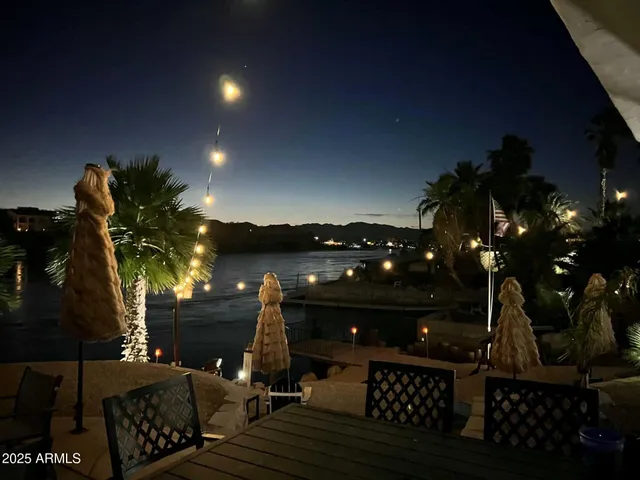 a view of a patio with swimming pool table and chairs